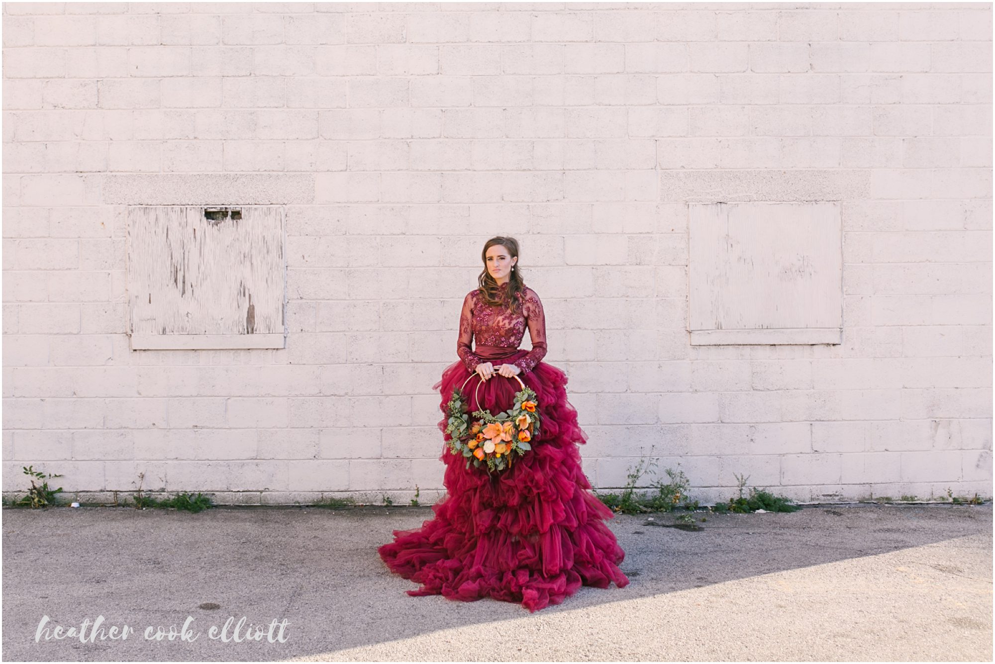 The Ivy House wedding with red dress and warm cherry accents plus gold and mustard details