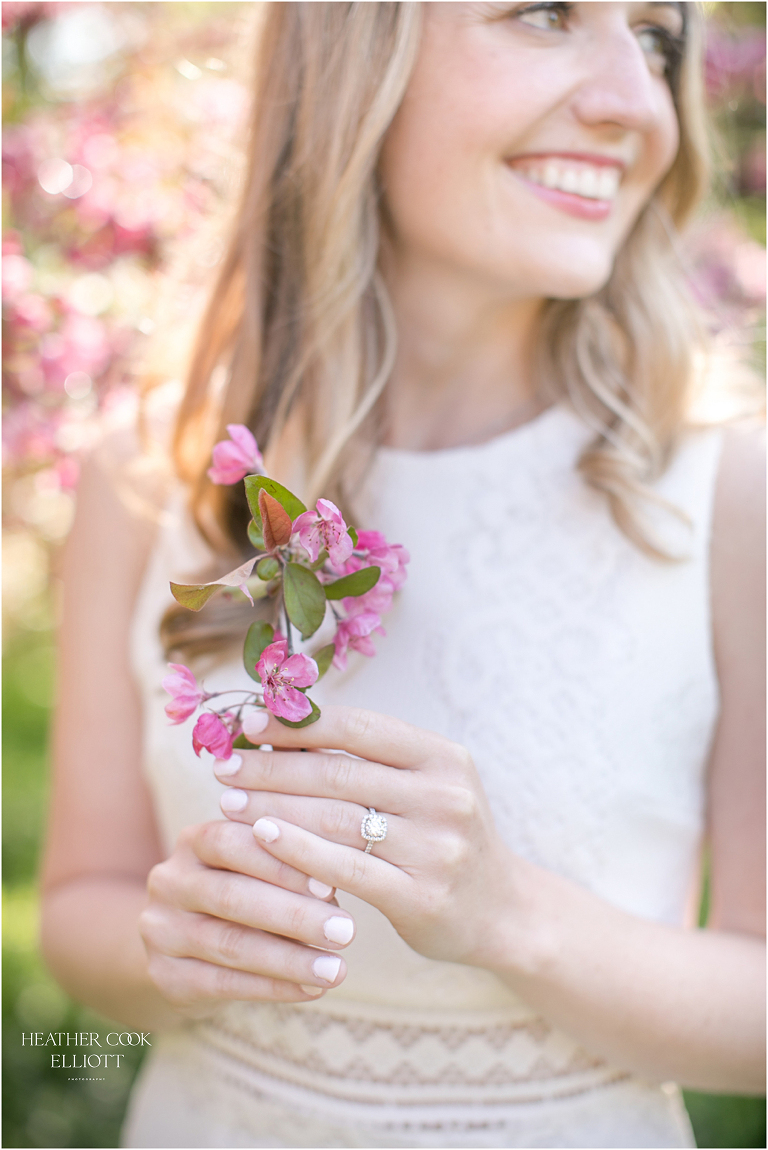 lake park engagement session with flowering trees
