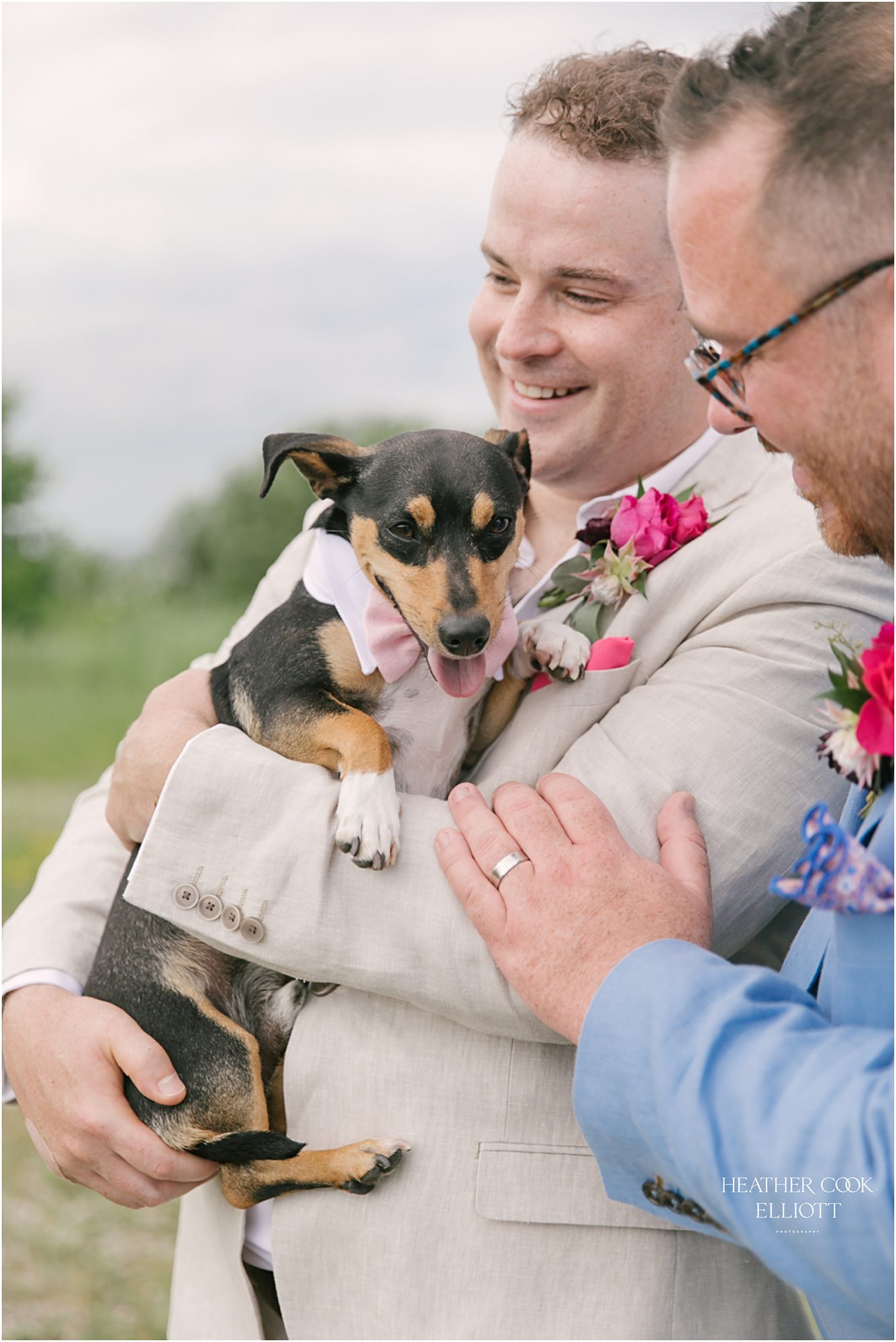 Milwaukee outdoor same sex wedding at port of milwaukee with gorgeous florals and rescue dog