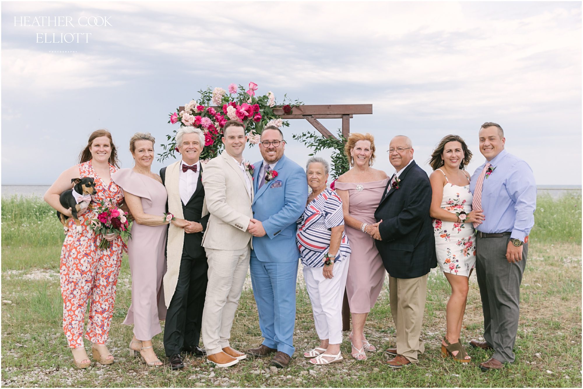 Milwaukee outdoor same sex wedding at port of milwaukee with gorgeous florals and rescue dog