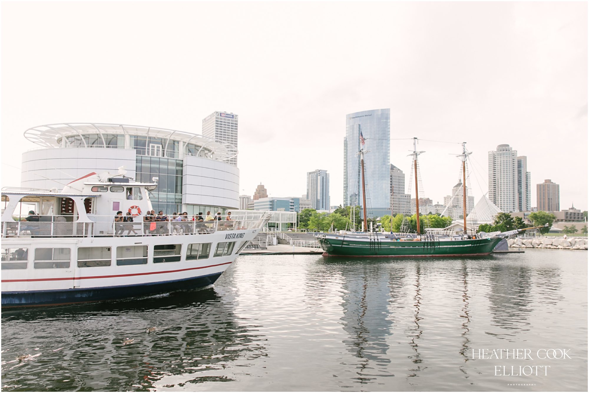 Milwaukee outdoor same sex wedding at port of milwaukee with gorgeous florals and rescue dog