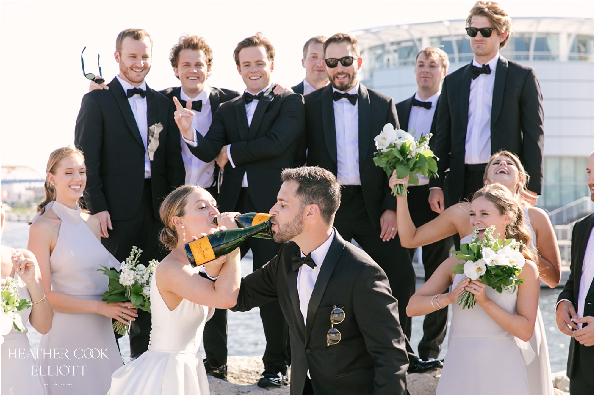 champagne toast at milwaukee lakefront for wedding bridal party